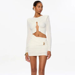 Woman wearing a white dress with cut-out design on a white background