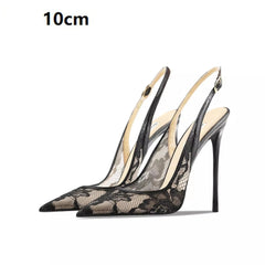 Black lace high-heeled shoes on a white background