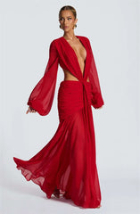 Red evening gown with long sleeves on a white background