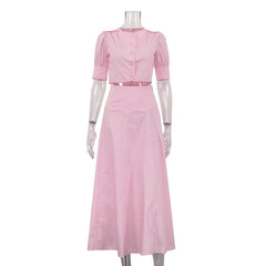 Pink dress on a mannequin against a white background
