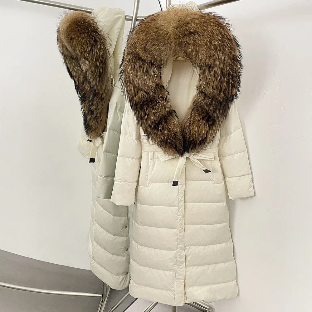 White puffer coat with brown fur hood on a white background