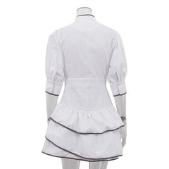White dress with black trim on a mannequin against a white background