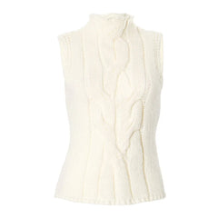 White cable knit sleeveless sweater on a white background