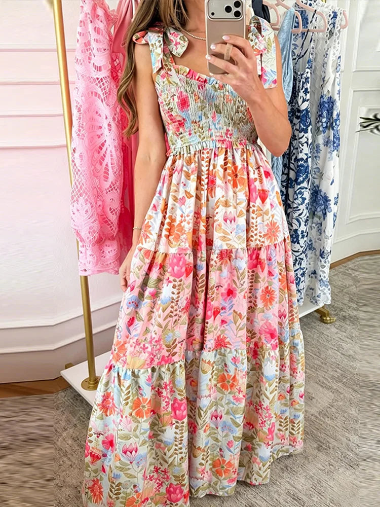 Close-up of a floral smocked bust tie strap maxi dress.