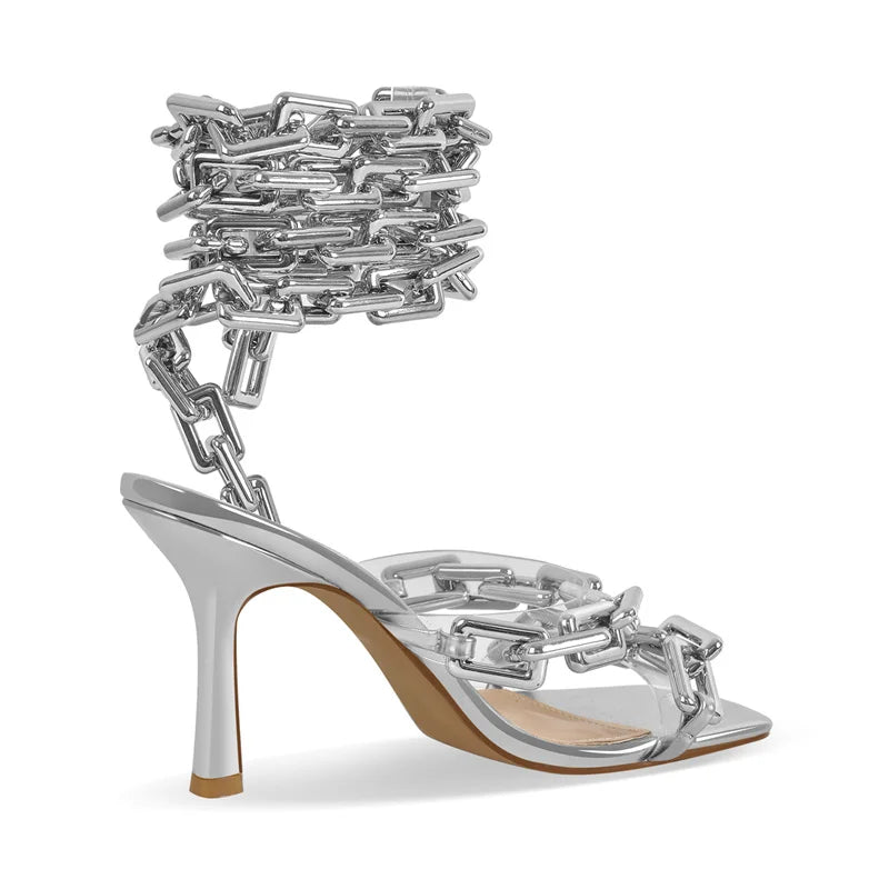 Side view of silver chain ankle-wrap stiletto sandals