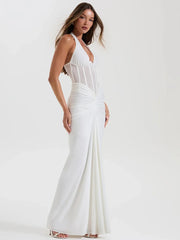 White halter neck maxi dress with sheer bodice and ruched skirt from the front
