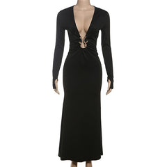Black long-sleeve dress with a deep neckline on a mannequin
