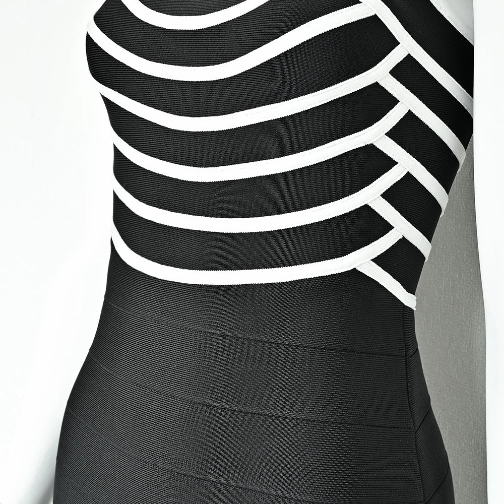 Black dress with white stripes on a plain background