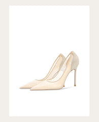 Pair of beige high-heeled shoes on a white background