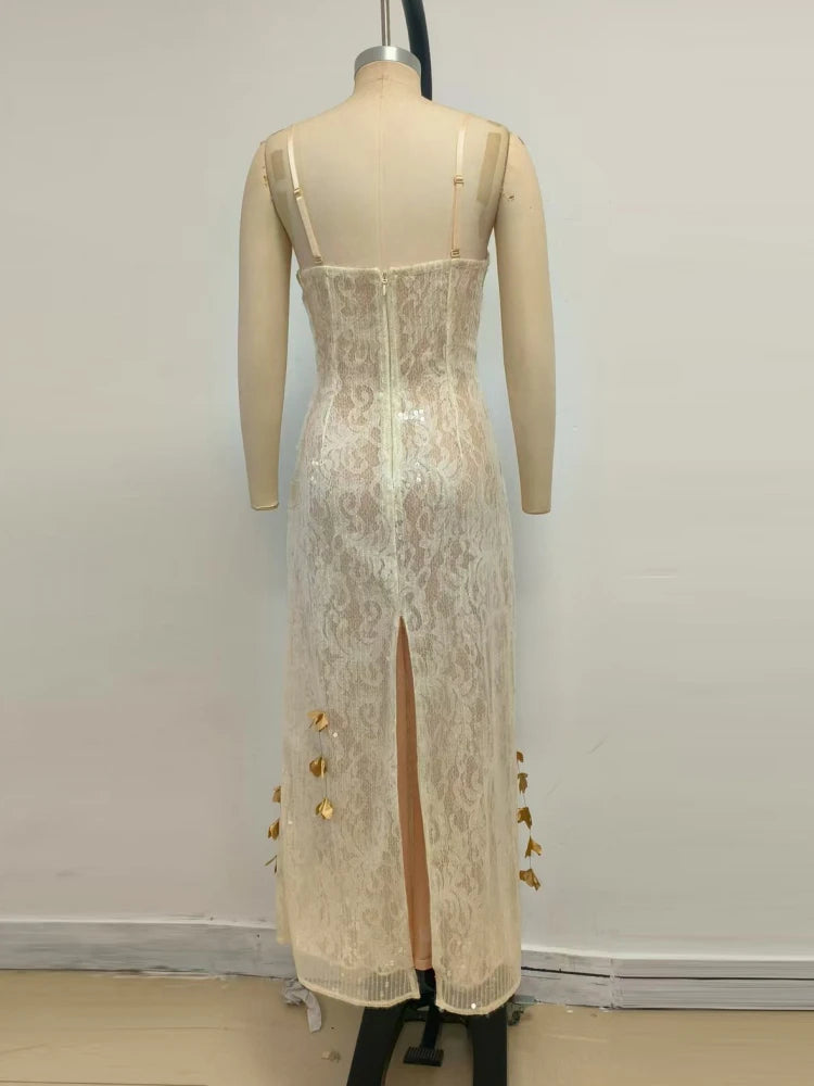 Beige lace dress with gold buttons on a mannequin against a plain background