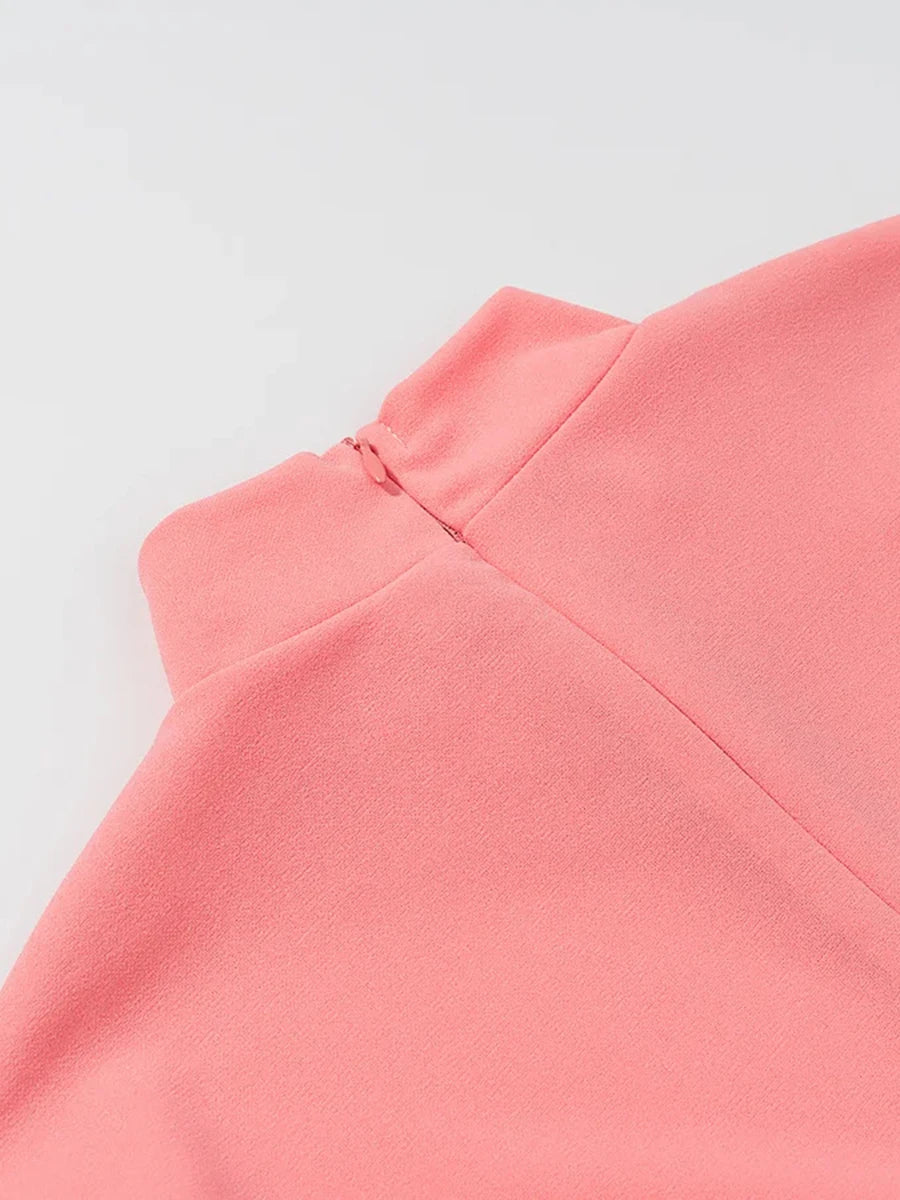 Close-up of a pink garment on a light gray background
