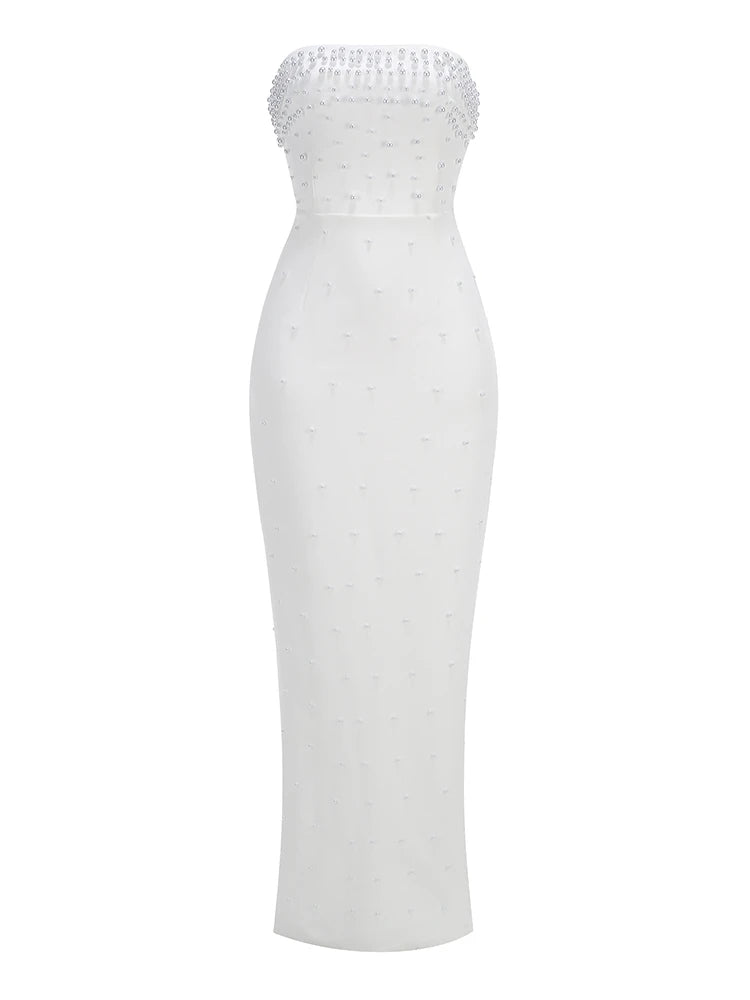 White strapless dress with beaded top on a white background