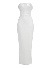 White strapless dress with beaded top on a white background