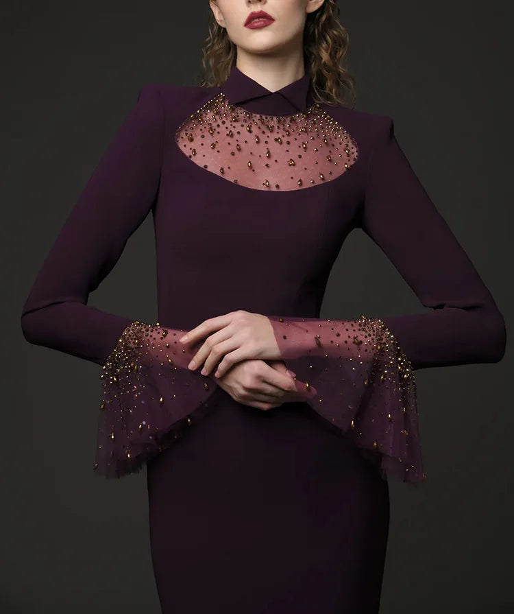 Close-up of beaded mesh neckline and flare sleeves on maxi dress