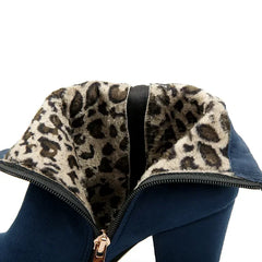 Close-up of a blue jacket with leopard print hood on a white background