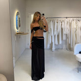 Black bikini top and sheer maxi skirt cover-up