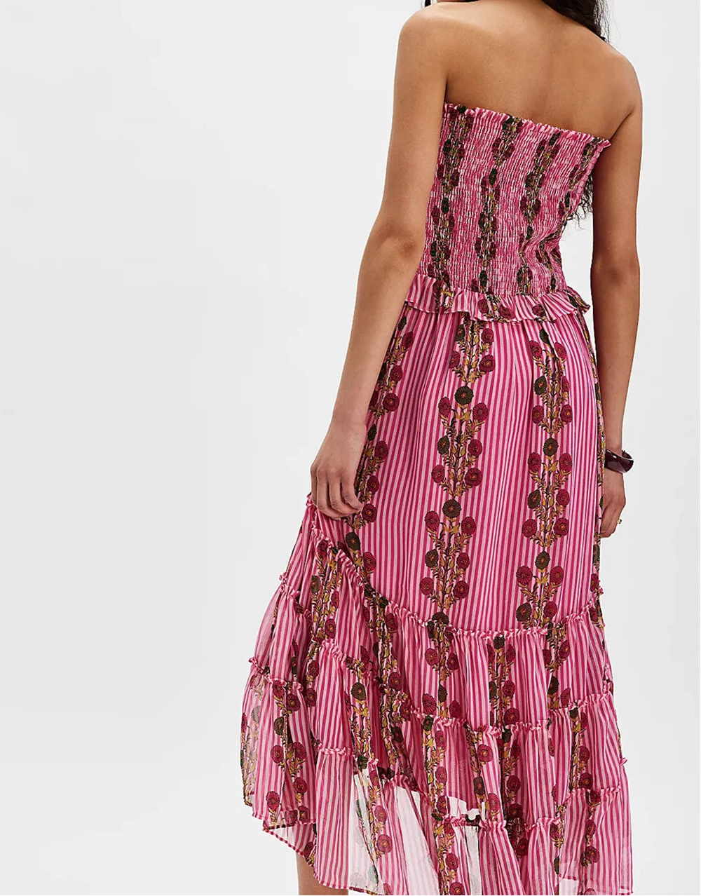 Pink strapless dress with floral pattern on a white background