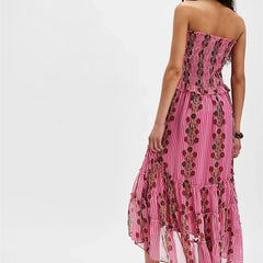 Pink strapless dress with floral pattern on a white background