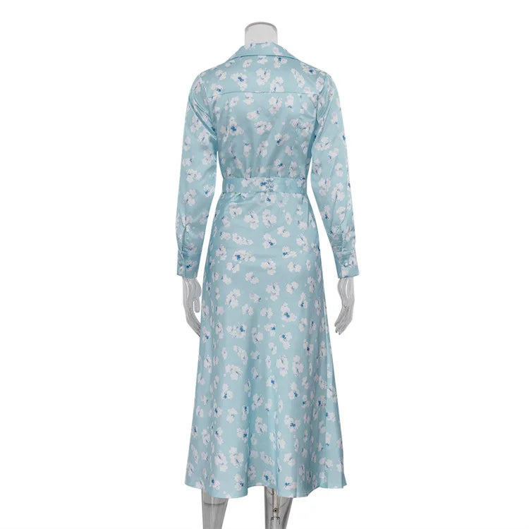 Light blue floral dress on a mannequin against a white background