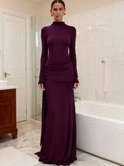 Purple turtleneck draped maxi dress in bathroom setting
