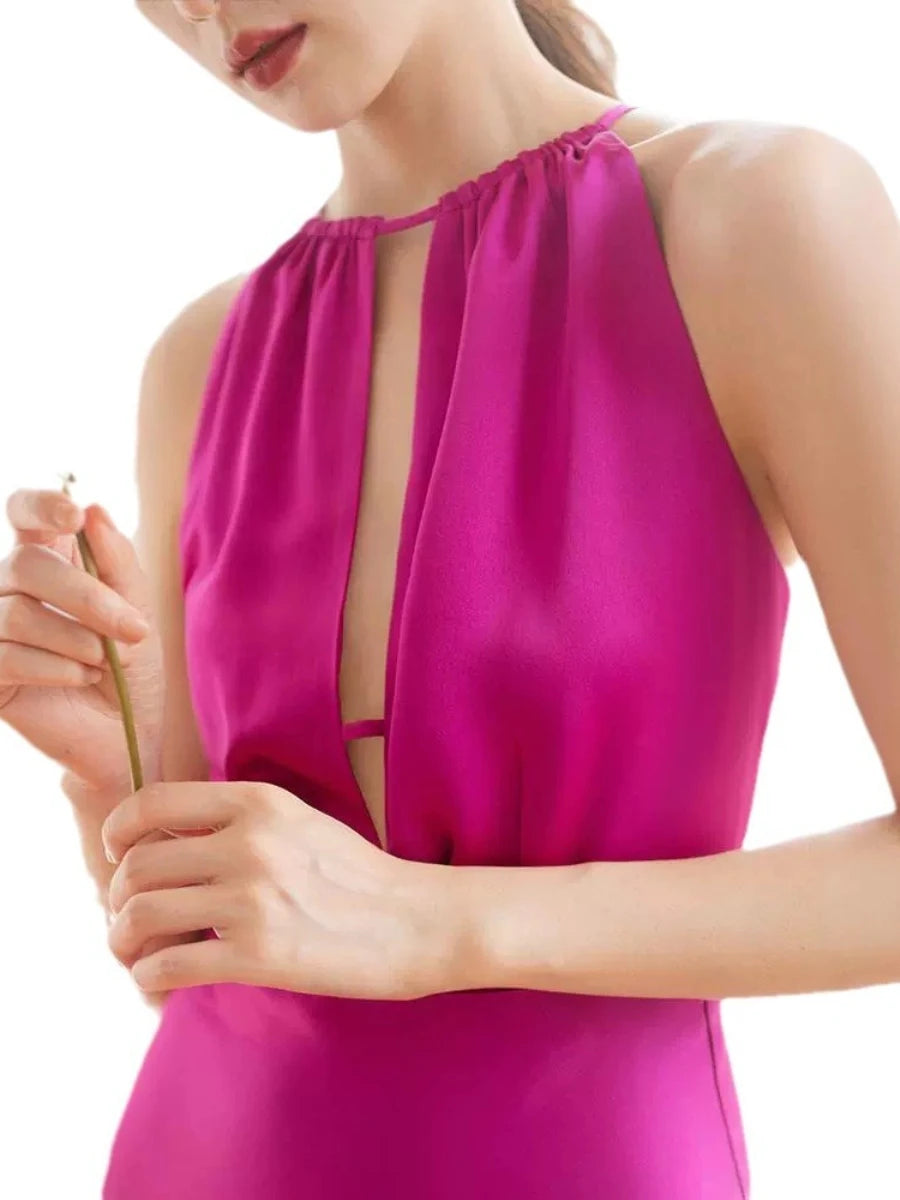 Close-up of a bright pink sleeveless top worn by a person