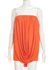 Orange sleeveless dress on a mannequin against a white background