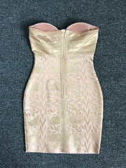 Gold strapless dress with geometric pattern on a dark gray background