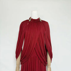 Red dress on a mannequin against a white background