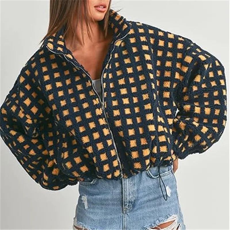 Plaid jacket with checkered pattern worn by a person on a plain background