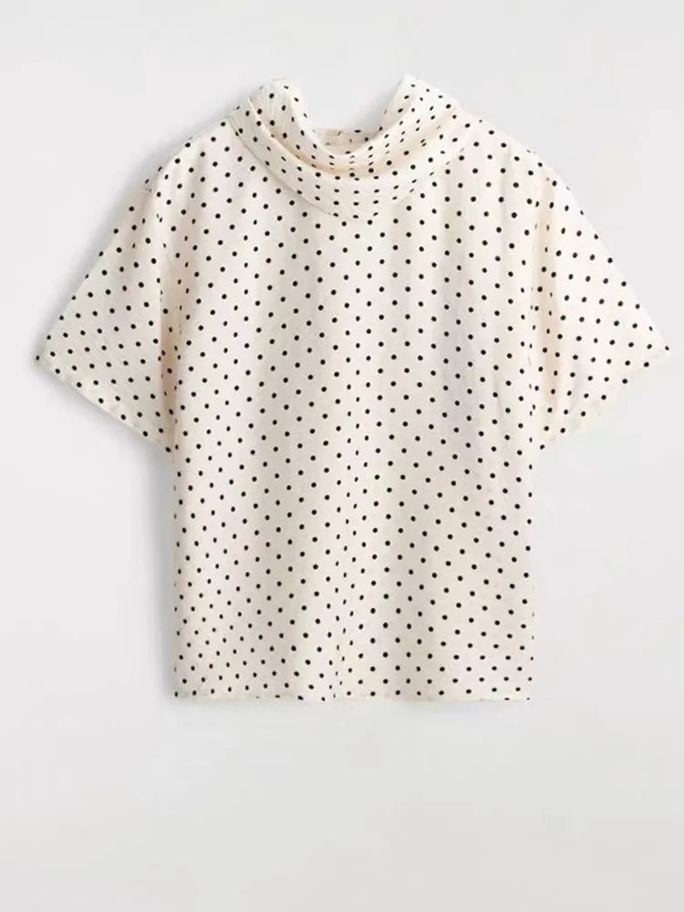 Polka dot mock neck short sleeve top flat lay