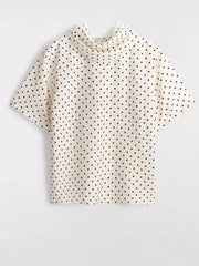 Polka dot mock neck short sleeve top flat lay