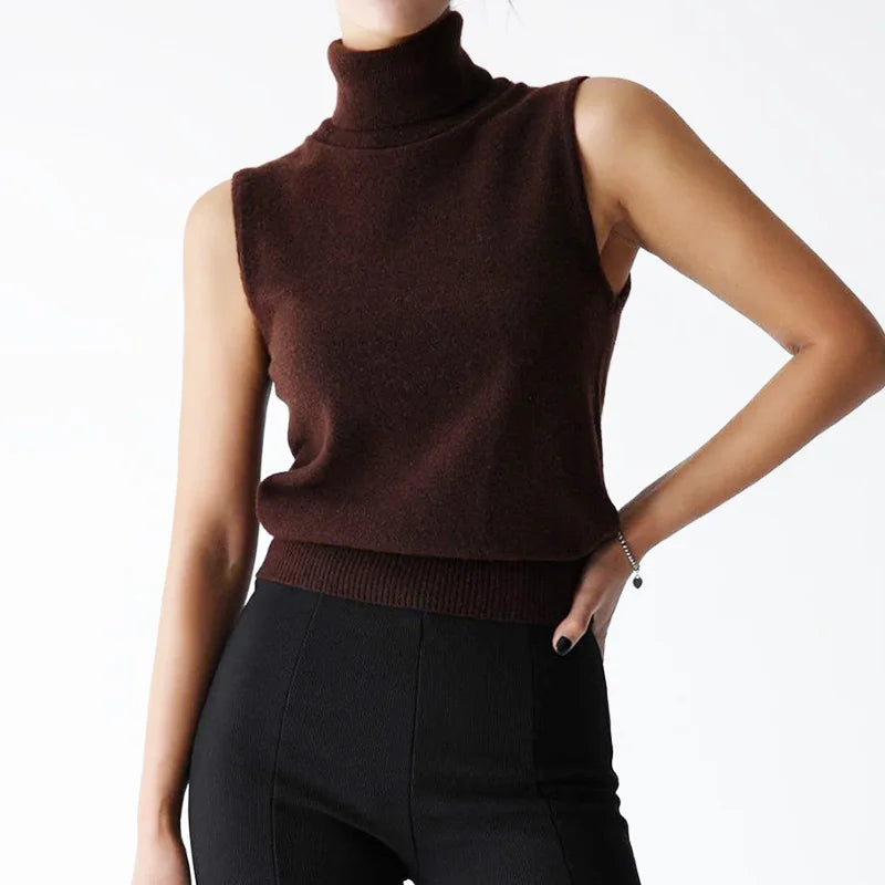 Brown sleeveless turtleneck sweater worn by a person on a white background