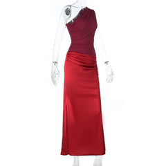 Red evening gown on a white mannequin against a white background