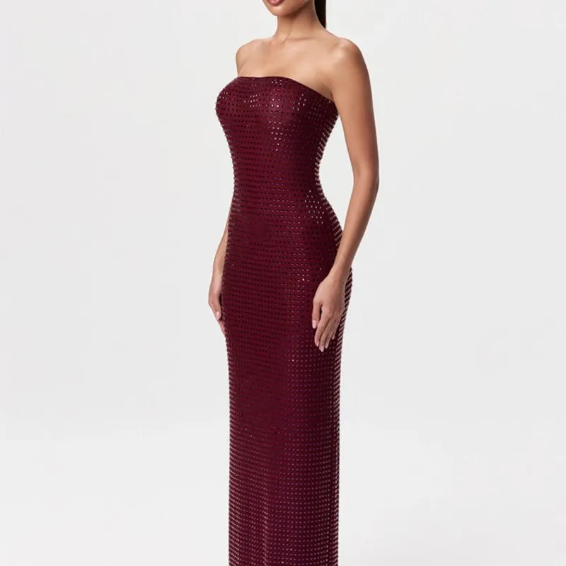 Burgundy strapless gown on a white background