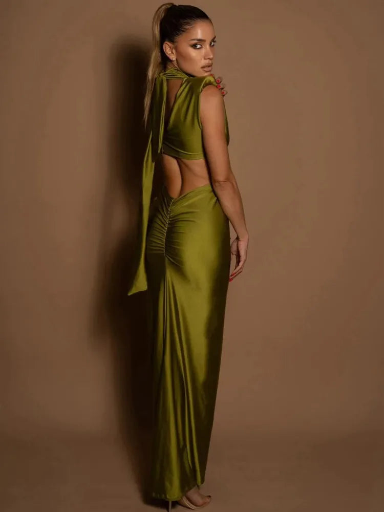 Woman wearing a green outfit against a brown background