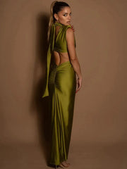 Woman wearing a green outfit against a brown background