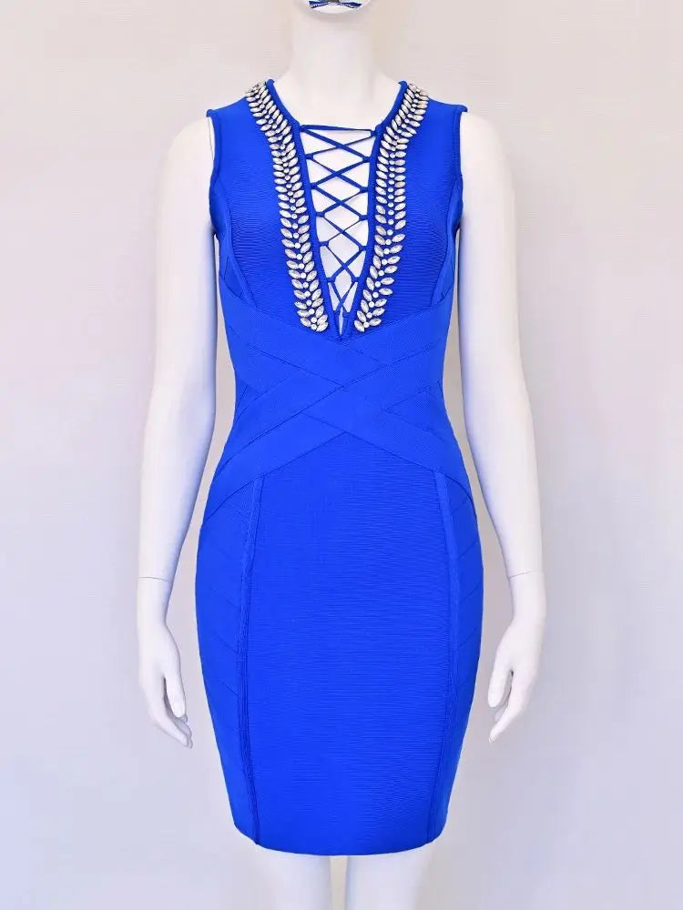 Blue dress with intricate detailing on a mannequin against a white background