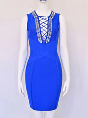 Blue dress with intricate detailing on a mannequin against a white background