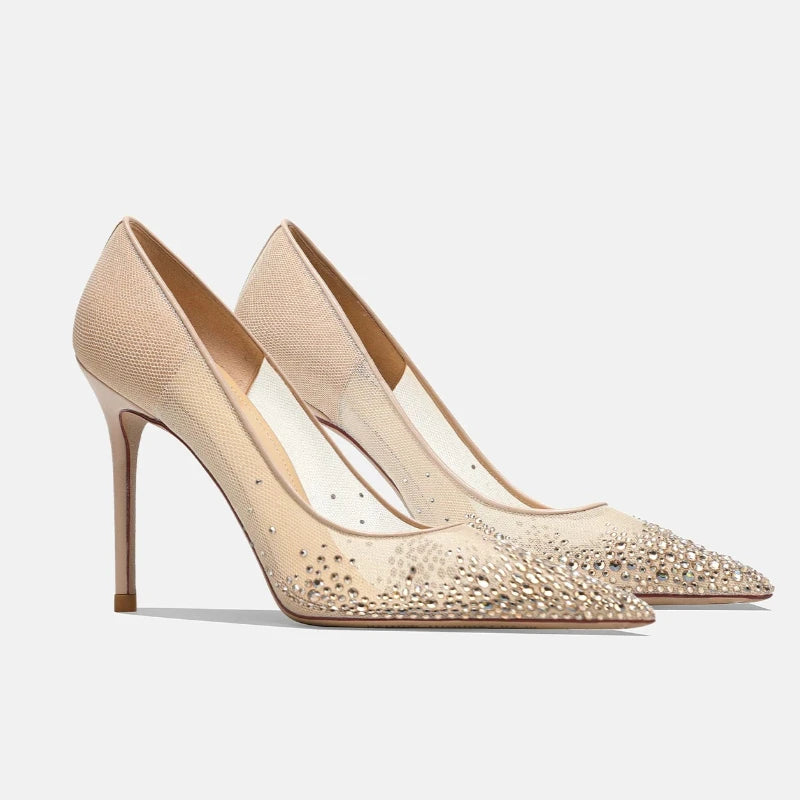 Pair of champagne rhinestone mesh stiletto pumps