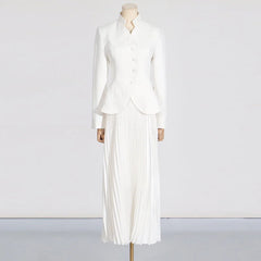 Mannequin wearing a white outfit with a jacket and pleated skirt on a plain background