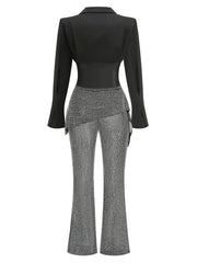 Black blazer and gray patterned pants on a white background