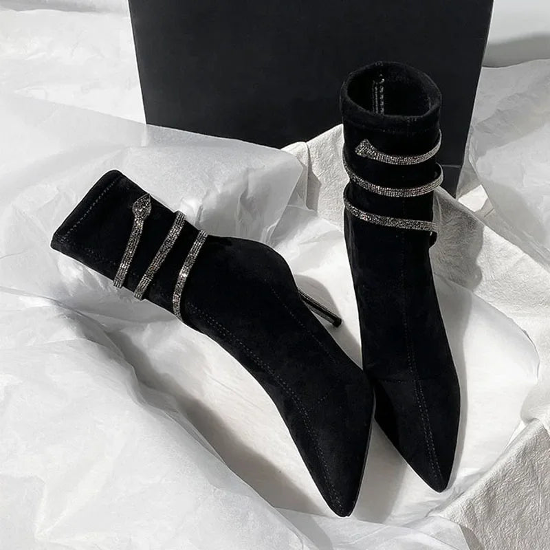 Close-up of the crystal detail on pointed toe ankle boots