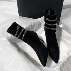 Close-up of the crystal detail on pointed toe ankle boots