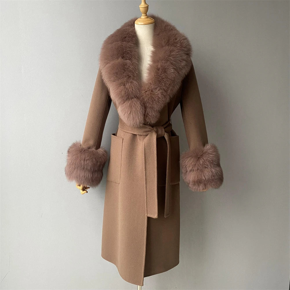 Brown coat with fur accents on a mannequin against a plain background