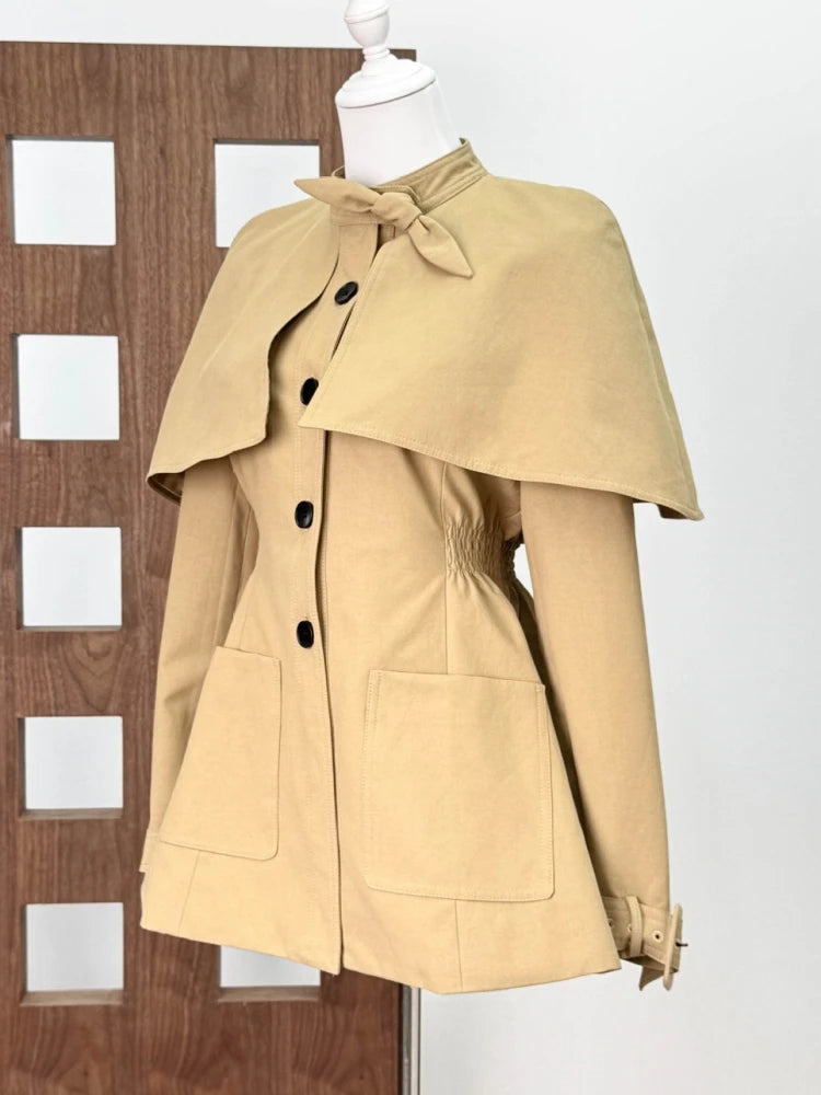Beige cape coat on a mannequin