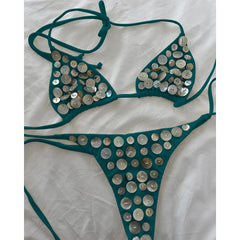 Teal bikini set with circular iridescent button embellishments.