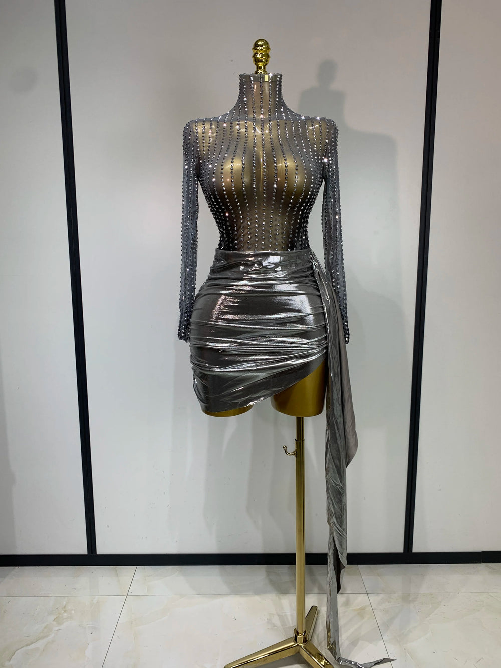 Silver long sleeve turtleneck mini dress with embellishments and draped skirt