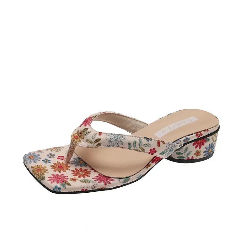 Floral patterned sandal on a white background