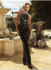 Model wearing a black sequin evening dress with intricate crystal detailing