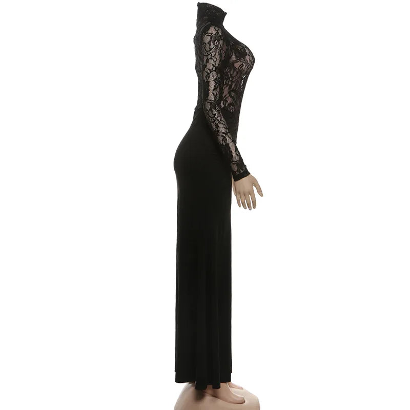 Black lace evening gown on a mannequin against a white background